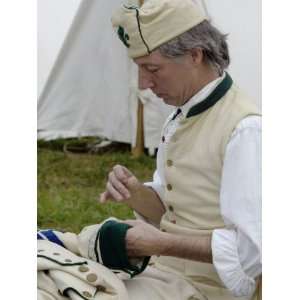  French Soldier Repairing His Uniform in a Reenactment at 
