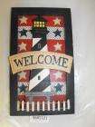 wooden welcome sign lighthouse and little white picket fence red white 