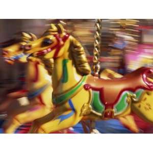  Motion Blur of Brightly Painted Merry Go Round Horses at 