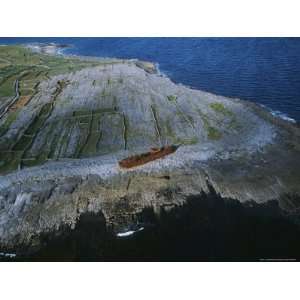  Rusted Hulk of a Ship Cast Upon Irelands Rocky Shore 