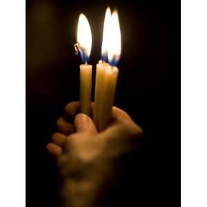 Christian Pilgrim Holds Candles, Participating in Easter Mass at the 