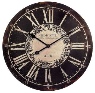   up for auction is a brand new round wall clock grand hotel is written