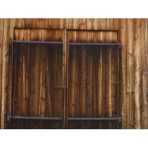 Tar Treated Rough Wooden Siding on a House with Doors Photographic 