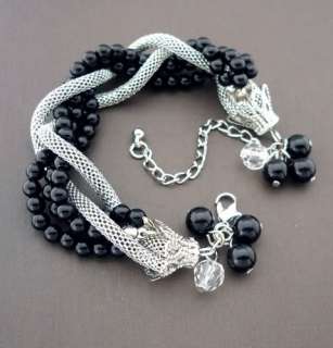You are looking at BLACK BEADS AND SILVER TWISTED BRACELET 