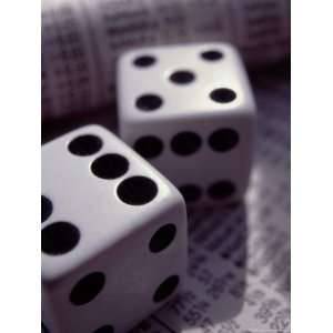 Dice Sitting on Financial Pages Photos To Go Collection Photographic 