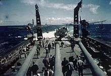 Two Kingfishers on their catapults on board the USS Quincy