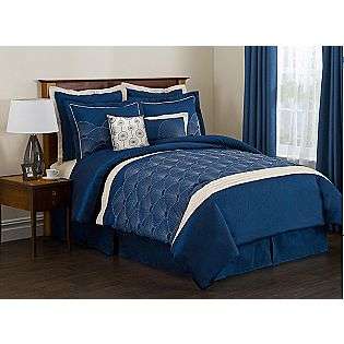   an elegant bed set with silver embroidery on navy faux silk matching