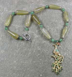   the beads are green jade round beads light green agate tube beads the