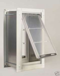 Dog door for wall installation and locking cover flap  