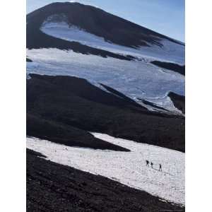 Walkers on Snow Field Below Steaming Summit Cone, 2741M High, Unesco 