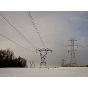  Rows of Powerline Towers Cut Through Winter Countryside 